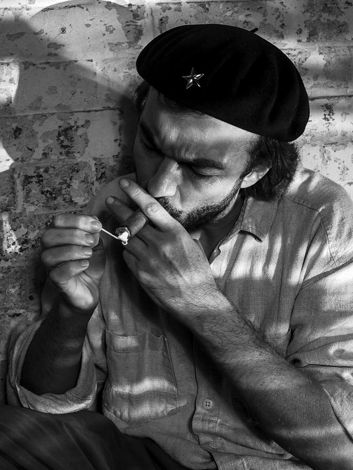 CHE LIGHTING A CIGAR copy